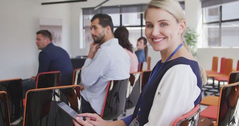 Smiling Businesswoman Engaging in Office Conference