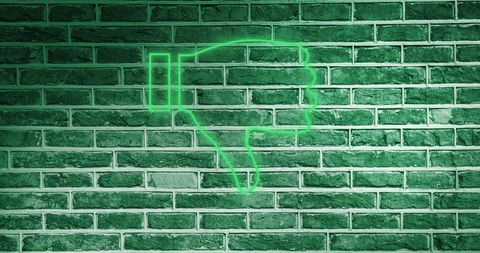 Neon Thumbs Down Symbol on Illuminated Brick Wall - Download Free Stock Images Pikwizard.com