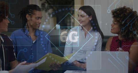 Young Professionals Discussing 6G Technologies in Modern Office