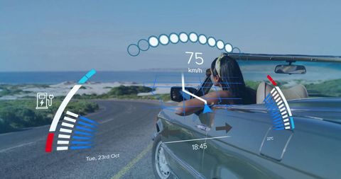 Driving Convertible by Ocean with Digital Data Overlay