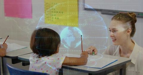 Teacher tutoring student with holographic globe overlay, one-on-one classroom learning