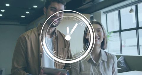 Smiling Coworkers Holding Tablet in Modern Office Lounge