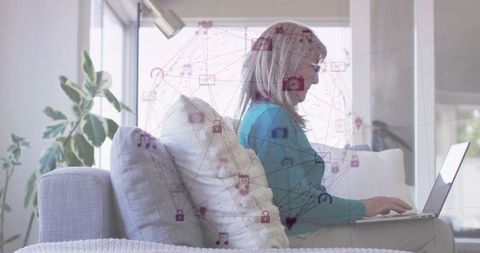Senior Woman Using Laptop with Network Symbols Overlaid