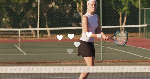 Tennis Player in Action on Outdoor Court with Heart Graphics