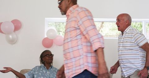 Senior Friends Enjoying Birthday Celebration at Home