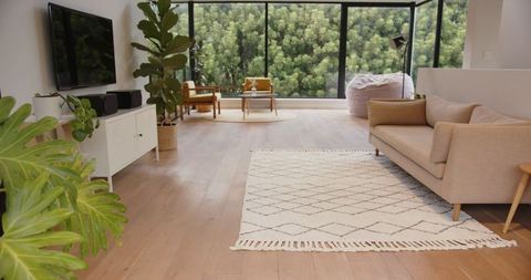 Modern Living Room with Natural Light and Forest Views