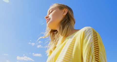 Serene Woman Enjoying Sunshine with Copy Space
