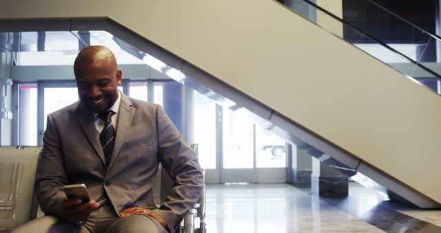 Businessman Smiling When Using Smartphone in Modern Office Lobby - Download Free Stock Images Pikwizard.com