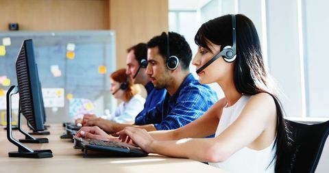 Diverse Professionals Working in Busy Call Center Environment - Download Free Stock Images Pikwizard.com