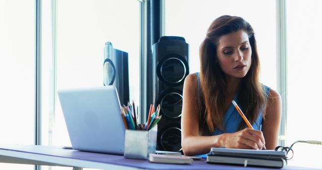 Focused Woman Working from Home Office Desk with Laptop and Tablet - Download Free Stock Images Pikwizard.com