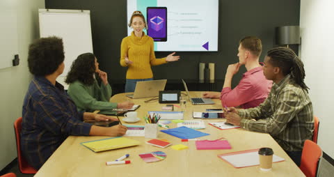 Diverse Business Team in Active Meeting at Modern Office