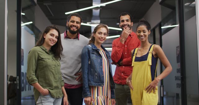 Diverse Group of Happy Young Adults Posing Together in Modern Office - Download Free Stock Images Pikwizard.com