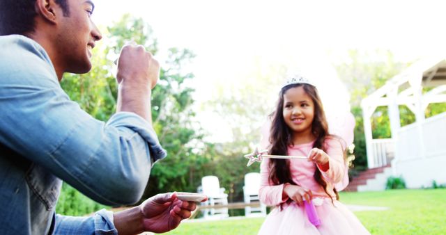 Father and Daughter Blowing Bubbles Outdoors on a Sunny Day - Download Free Stock Photos Pikwizard.com