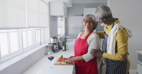 Senior Couple Cooking in Bright Kitchen Sharing Joy