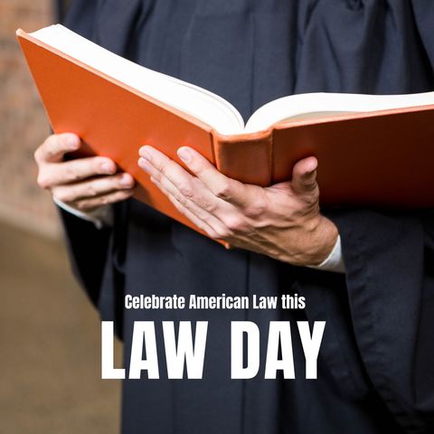 lawyer holding book celebrating law day - Download Free Stock Templates Pikwizard.com