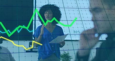 Team leader presenting interactive analytics on glass display during collaborative meeting