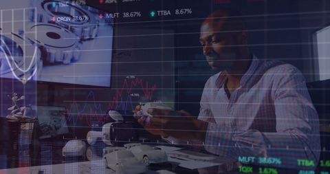 African American Businessman Analyzing Financial Data with Virtual Interface