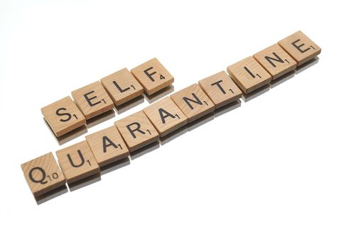 Self Quarantine Scrabble Letters Against White Background