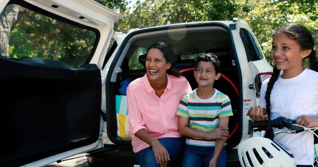 Happy Family Unpacking Car for Outdoor Adventure - Download Free Stock Images Pikwizard.com