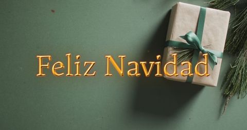 Festive Feliz Navidad Greeting with Gift Background - Download Free Stock Images Pikwizard.com