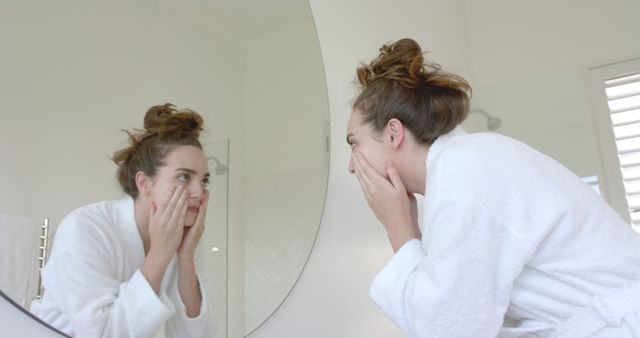 Young Woman Checking Skin in Bathroom Mirror - Download Free Stock Images Pikwizard.com