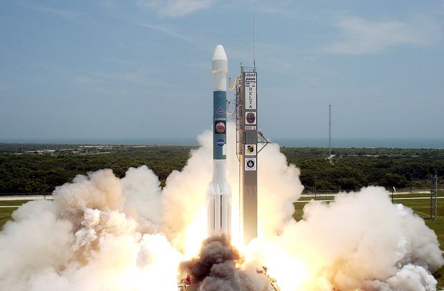 Delta II rocket launching from Cape Canaveral with Mars Exploration Rover Spirit, giving a powerful lift-off. Artwork for science, technology, space exploration, and educational materials. Useful for space travel blogs, documentaries, and aerospace industry publications.