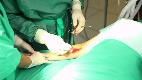 Surgeon Performing Operation in Surgical Room