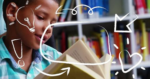 Young boy reading hardcover book in colorful library with chalk doodle overlay, copy space