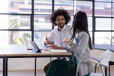 Diverse Teammates Discussing Ideas in Modern Office