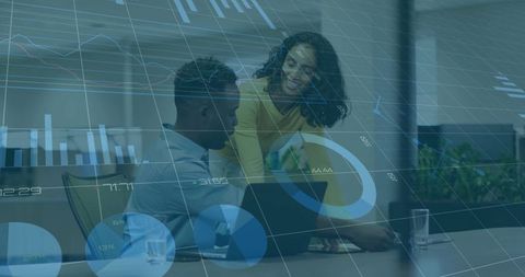 Collaborating with data dashboards, guiding colleague on laptop using analytics overlays