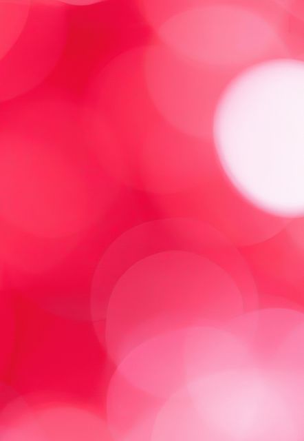 Vibrant and colorful pink and red bokeh background with glowing light spots. Ideal for holiday decorations, festive cards, party invitations, digital wallpapers, or creative presentations requiring a soft and cheerful atmosphere. It can also be used in social media graphics, blog designs, or as a backdrop for web pages to add a vibrant and lively touch.