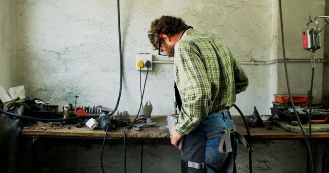 Craftsman working in his workshop for metal fabrication - Download Free Stock Images Pikwizard.com