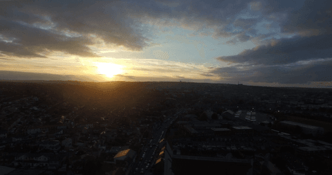 transparent sunset over urban silhouette against cloudy sky - Download Free Stock Videos Pikwizard.com