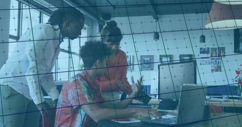 Professionals Collaborating in Modern Office Demonstrating Teamwork and Innovation