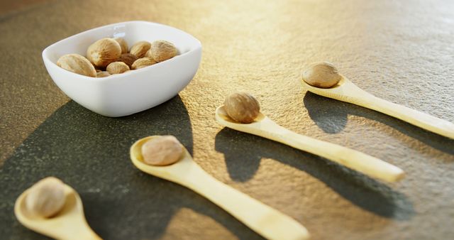 Whole Nutmeg Spice in Bowl with Wooden Spoons - Download Free Stock Images Pikwizard.com