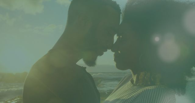 A romantic scene of a couple embracing by the ocean during sunset. Perfect for use in relationship articles, advertisements for romantic getaways, or to represent concepts of love and intimacy in various media.