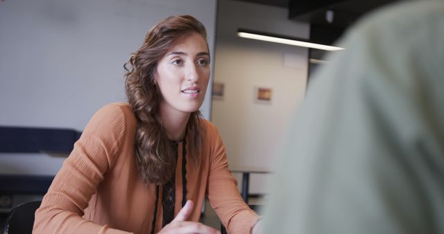 Young Businesswoman Engaging in Business Meeting in Office - Download Free Stock Images Pikwizard.com