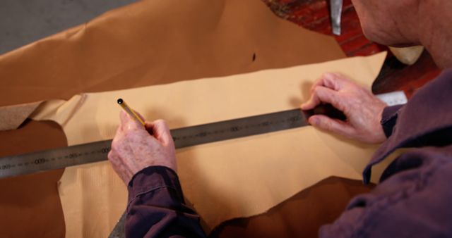 Craftsman Measuring Leather with Ruler Preparing for Cutting - Download Free Stock Images Pikwizard.com