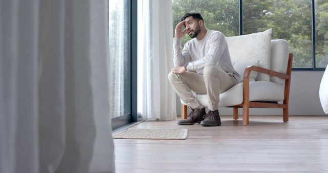 Pensive Man Reflecting at Home by Large Window - Download Free Stock Images Pikwizard.com