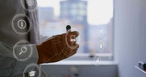 Businessman interacting with holographic interface using stylus at urban office window