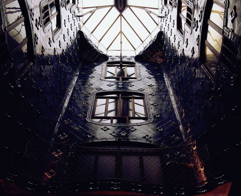 Midnight blue ceramic atrium with organic curved windows and skylight in art nouveau