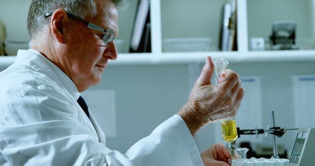 Male Scientist Conducting Laboratory Experiment with Test Tube - Download Free Stock Images Pikwizard.com