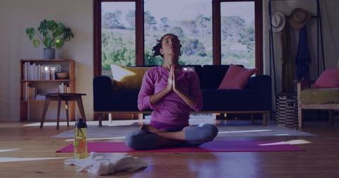 Mature Woman Practicing Yoga for Mindfulness in Living Room