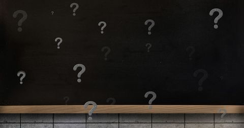 Mystery and questions concept on blank blackboard