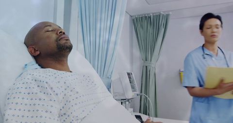 Nurse Attending to Patient in Hospital Ward