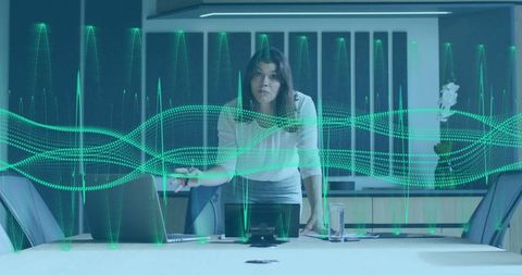 Businesswoman presenting data visualization in modern office