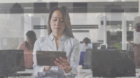 Focused Businesswoman Using Tablet with Urban Overlay