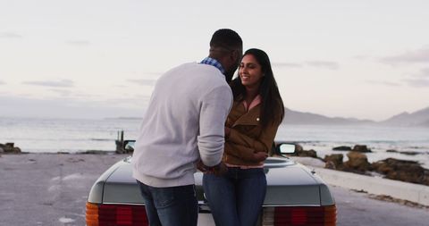 Romantic Proposal Couple by Convertible and Ocean