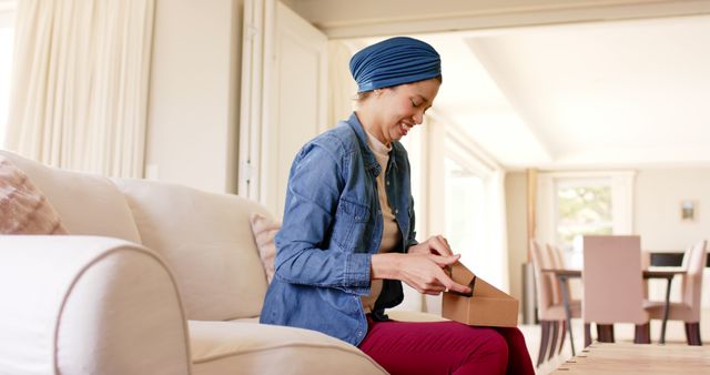 Happy Woman Opening Package on Couch at Home - Download Free Stock Images Pikwizard.com