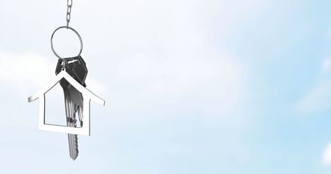 house key on chain hanging against sky background - Download Free Stock Images Pikwizard.com
